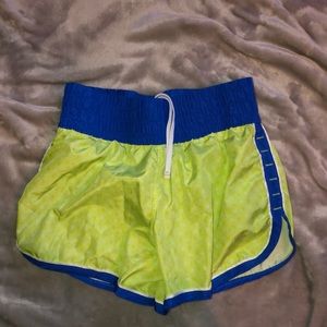 Green and blue running shorts